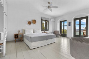 Wake up to stunning sea views from this spacious bedroom with a king-size bed.