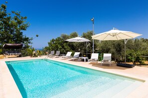 40 square meters swimming pool with sun beds