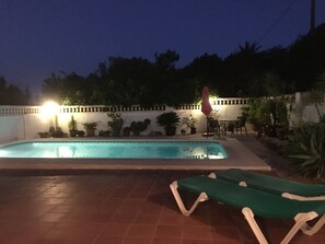 Enjoy an evening cocktail by the pool