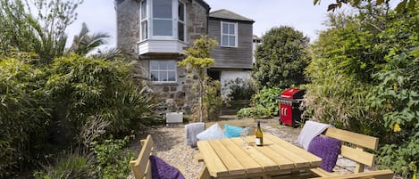 Outside dining in the stunning secluded garden.