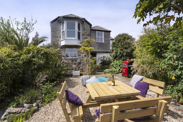 Outside dining in the stunning secluded garden.