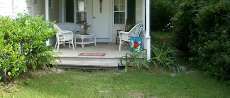 Front porch is  relaxing place to have morning coffee.
