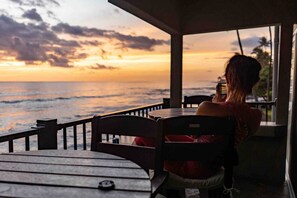 Jennifer watching the surfers at sunset.