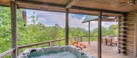 Soak in the hot tub next to amazing views!