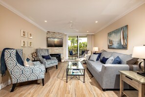 The gorgeous living room of Beach Bliss is furnished with a custom-made queen sleeper sofa with an extra deep mattress.