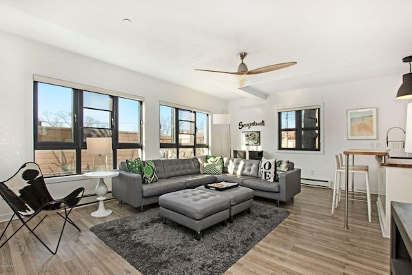 Modern open living space is full of natural light.