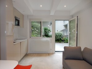 Salon cuisine sur Jardin