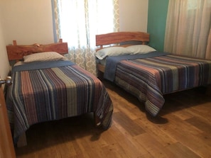 Bedroom with full size and twin size beds 
