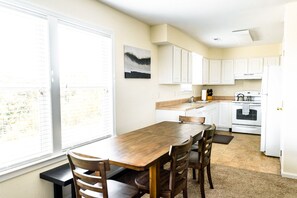 Dining area with seating for 6 and fully equipped kitchen. 