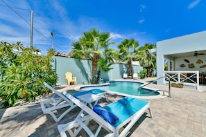 Our private pool and gardens make the perfect backyard oasis.