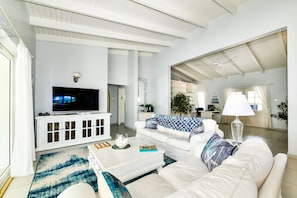 Cozy living area, 55” TV, overlooking private pool and lanai.