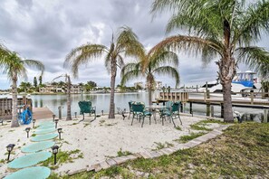 This 1-bedroom, 1-bath condo sits right on the canal with a sandy beach and dock