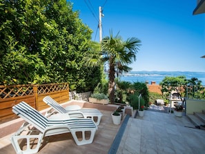Plant, Sky, Water, Furniture, Table, Seaside Resort, Building, Outdoor Furniture, Shade, Arecales