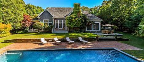 Heated gunite pool. 4 lounge chairs, 2 umbrellas and a daybed.