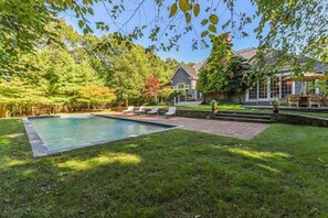 Heated gunite pool. 4 lounge chairs, 2 umbrellas and a daybed.