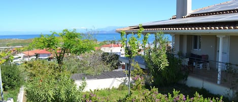 The house and the garden with the Corinthian Gulf in the background.