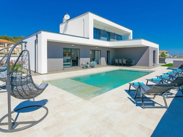 Sky, Property, Furniture, Building, Window, Swimming Pool, Blue, Azure, Shade, Outdoor Furniture