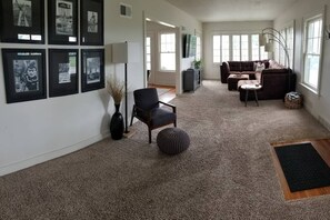 Spacious front living room with a beautiful view of the Emporia Country Club. 