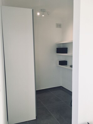 Walk in closet and laundry room (storage,washing machine,iron, iron board etc)