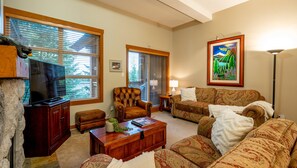 Main Floor - Living Room With Gas Fireplace & Queen Sofabed