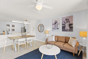 Open-concept kitchen and living room with a cozy, modern design
