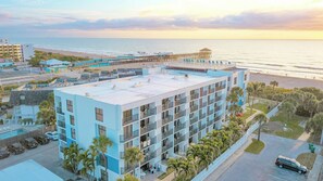 Stunning aerial view of the beachfront property at sunset