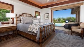 Master bedroom with poolside views