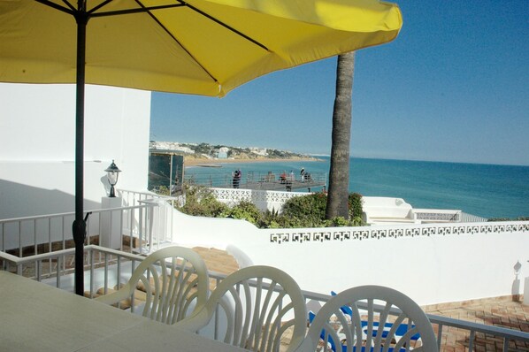 terrace with table, chairs and a built in BBQ with incredible views