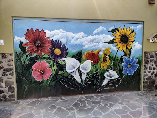 Colorful street mural welcomes you to Casa Felicidad Casita!