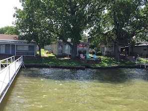 Back of cabin and deck area facing the lake.  Picture was taken from the dock.