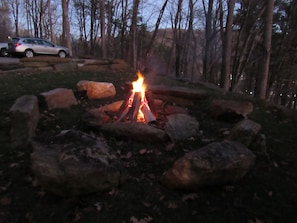 Boulder firepit with firewood included