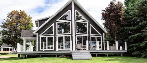 Back of house with lots of windows for your waterfront views