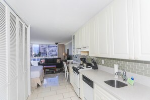 Fully equipped kitchen, large walk-in closet across the kitchen.