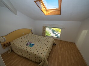 The master bedroom upstairs features a Double bed.