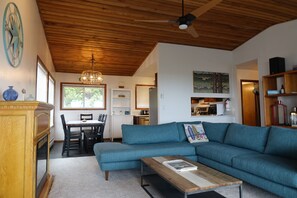 Living room offers easy access to the kitchen and dining table.