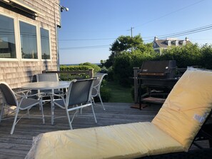 Sunshine on the Deck, loungers and a table for 4. 