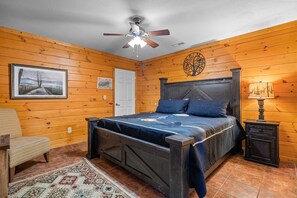 spacious lower level king bedroom, hallway bathroom is shared with the bunk room 