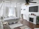 Studio with King bed, king pillows, fireplace, smart tv, deck, ceiling fan