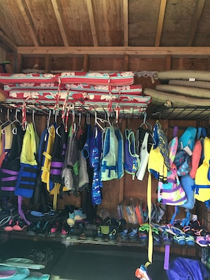 A plethora of life jackets, water shoes & games for guests’ use. 