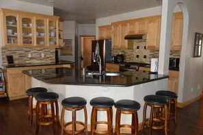 Updated kitchen that seats 7 at the counter. Newer appliances and dishes.