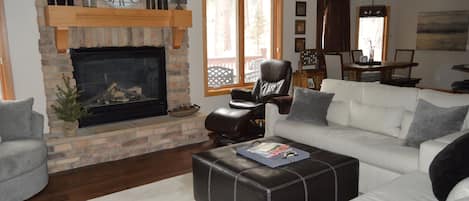 Main level living room with fireplace.