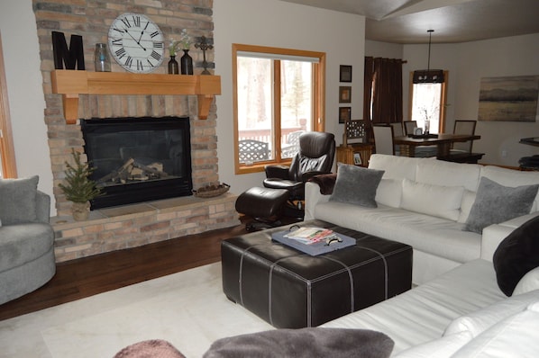 Main level living room with fireplace.