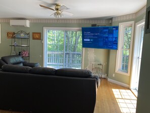 Enjoy our living room with a 70 inch Smart TV