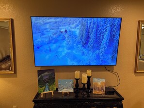 65 inch Samsung smart TV in the living room connected to dish TV (cable)