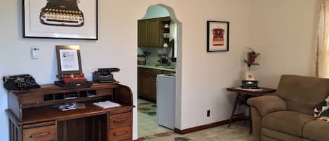 The antique writing desk is the main feature of the living room. 

