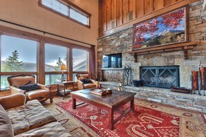 Spacious Living Room with a Warm Wood Burning Fireplace