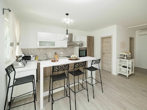 Furniture, Table, Wood, Chair, Cabinetry, Flooring, Interior Design, Rectangle, Floor, Kitchen