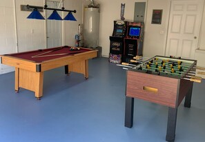 Fun games room with pool table, table football, 2 arcade machines, bar seating