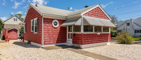 View of enclosed front porch from the street.