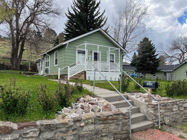 Mature trees, big yard, and only 2 blocks from Buffalo Bill’s Irma Hotel.